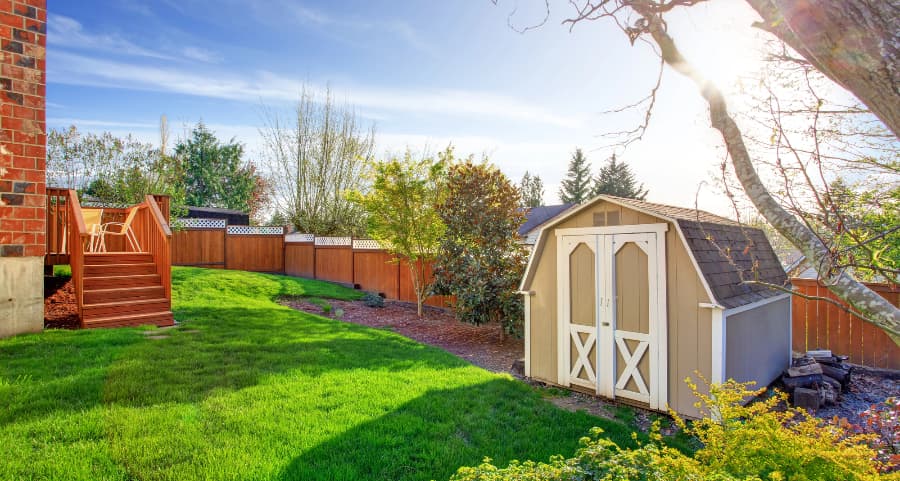 Fenced backyard with storage shed in Manhattan